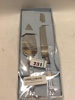 Photo of boxed two-piece wedding cake slice and serve knife set with clear faux crystal handles.