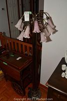 Full view of floor lamp upright showing all twelve shades and base