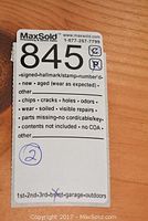 MaxSold labeled tag showing lot number and condition markings