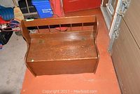 Top view of wooden bench with visible wear on the seating surface and sides