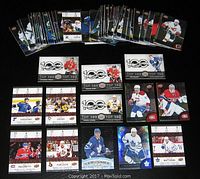Photo showing a spread of approximately 20 hockey trading cards from the 2017/18 Tim Horton's NHL series including Top 100 and Game Day Action cards.