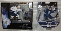 Front view of both Morgan Rielly and James Van Riemsdyke hockey figures in sealed packaging, showing the figures prominently.