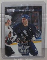 Front view of the Doug Gilmour signed hockey card in a clear protective plastic sleeve showing the full autograph and player image.