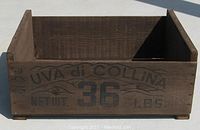 Front view of the espresso stained wooden grape crate showing the 'UVA di COLLINA 36 LBS' black printed marking.