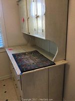 Side-angle view of the cabinet showing upper hutch and lower base cabinet.