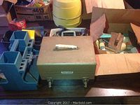 Craftsman metal toolboxes and hand saws with other assorted hand tools on table
