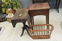 Overview of three items: vintage Duncan Phyfe style drop leaf end table, small wood end table with drawer, and a wood magazine rack.