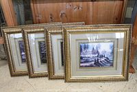 Set of four matching framed prints depicting a house and garden landscape, showing their size and frame design.