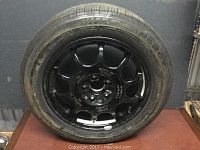 Full view of mounted spare tire showing black Ronal alloy wheel and Michelin tire