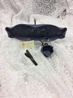 Blue Hilborn pottery baguette tray and small matching pot on white lace fabric. Includes two clear faceted crystal-like decorations and a dark wooden stick object.