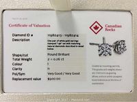 Valuation certificate showing diamond IDs, cut, weight, colour, clarity, polish/symmetry and replacement value
