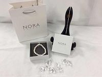 Nora Norway bag, jewelry box, bracelet and acrylic gems