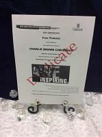 Photo of the gift certificate for 2 complimentary tickets to Charlie Brown Christmas with the Taurey Butler Trio, showing event date December 9, 2017, with DONATE watermark.