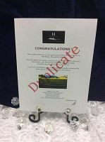 Front view of the Huff Estates certificate with logo, congratulations text, vineyard photo and signature
