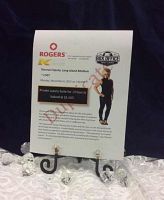 Printed sign on easel showing event name, venue, date, time and suite details