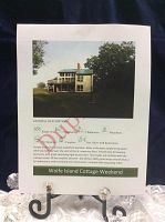Printed promotional listing showing exterior photo, cottage details, icons for bedrooms, bathrooms, waterfront