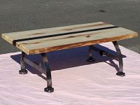 Poplar and roasted poplar wood top with live edge and metal legs, view from above