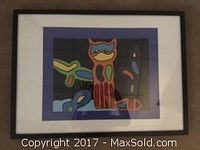 Framed original artwork featuring a colorful stylized owl and abstract shapes on a dark background.