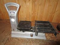 Wide view of the Exact scale and Ergy receipt machine on wooden surface.