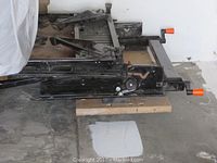 Manual scissor jack on garage floor