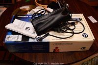 Overall view of VoiceWorks box, microphone cable on top, manual