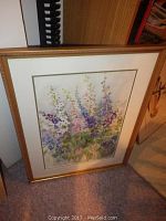 Front view of one framed watercolor painting with floral design, primarily purple and pink flowers.