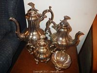 Four-piece tea and coffee service displayed together