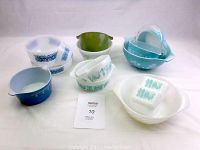 Eight bowls displayed front and back rows on white background