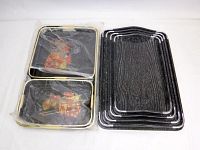 Photo showing 4 black wood nesting trays and 3 black lacquer trays in bag.