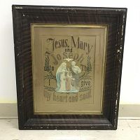 Framed needlepoint religious artwork showing full frame, fabric, and embossed figures.