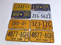 View of all 8 vintage US license plates from Pennsylvania, New York, and Virginia with visible numbers and dates