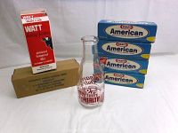 Wide shot showing all items in lot: Calnan's Dairy glass milk bottle, four Kraft American cheese boxes, one Kraft processed cheese box in beige cardboard, one Watt dairy frozen milk carton.