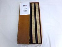 Original worn brown cardboard box containing four vintage score counters tile racks