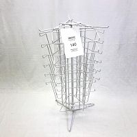 Front view of white wire magazine rack on the stand, showing all three sides with wire slots and the tripod base.