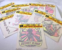 Ten sealed vintage 1970s Rat's Hole iron-on transfers arranged fanned out showing colorful designs in packaging.