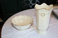 First photo shows both Lenox ivory porcelain bowl and hexagonal vase with gold trim side by side on a table.