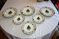 Set of Mikasa Heritage dinner and salad plates arranged on a table showing Christmas tree design.