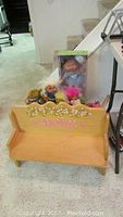 Cabbage Patch Kids doll new in box with troll dolls displayed on wooden doll bench