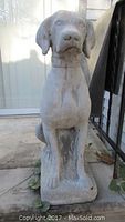 Front view of one sitting Labrador Retriever cement statue showing detailed facial features and collar.