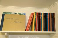 Shelf display showing Currier and Ives America alongside spines of Easton Press volumes