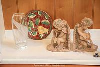 Photo showing Lenox vase, pear plate, and cherub bookends