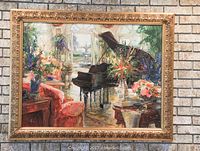 Framed Stephen Shortridge “Spring is in the Air” canvas in ornate gold-tone frame against brick wall