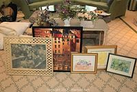 Full display of all five framed paintings and three flower baskets arranged on the floor and table