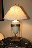 Front view of lamp on table, illuminated