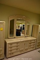 Front view of whole dresser with attached three-panel mirror, showing overall condition and design.