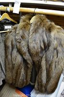 Front view of the Morris Kaye fur jacket showing thick brown and grey fur and collar
