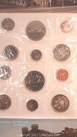 Photo of 1976 and 1978 Canadian coin specimens in original clear plastic sleeves showing all coin denominations from pennies to silver dollars.
