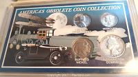 Top view of the four collectible coins displayed in a plastic case labeled 'America's Obsolete Coin Collection' with vintage car graphic.