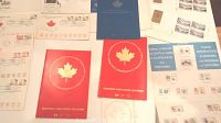 Overview of nine 1967 First Day Covers with commemorative Canadian stamps and cancellation marks, alongside three 1972 and 1973 stamp booklets including floral emblems and coat of arms booklet.