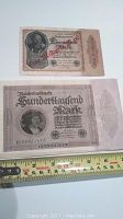Two German Reichsbanknotes side by side showing 100,000 Mark 1923 and 1,000 Mark 1922